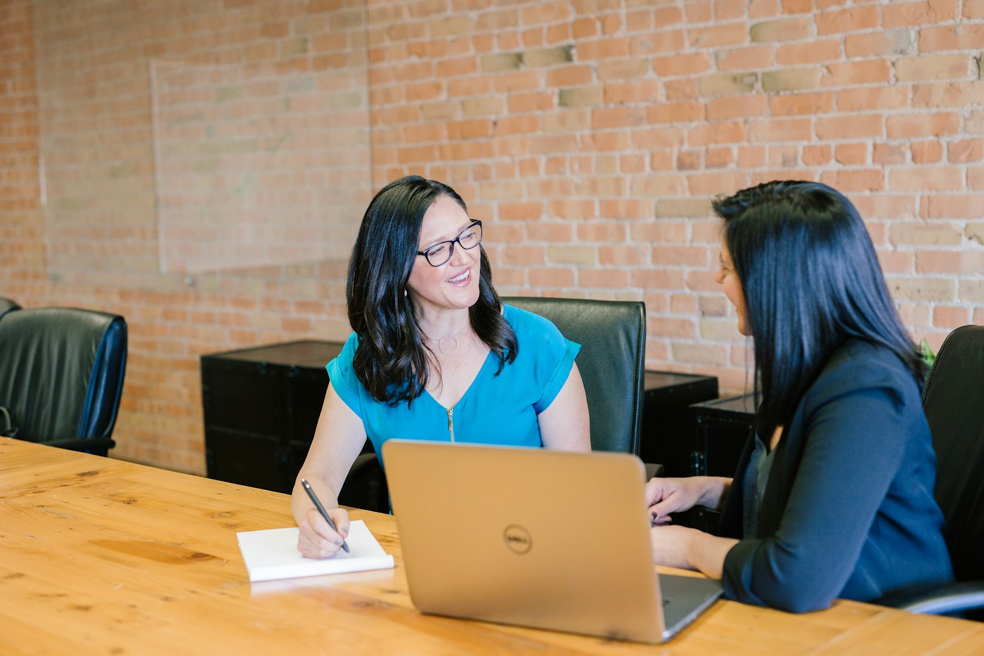 Team members discussing plans in a bright office